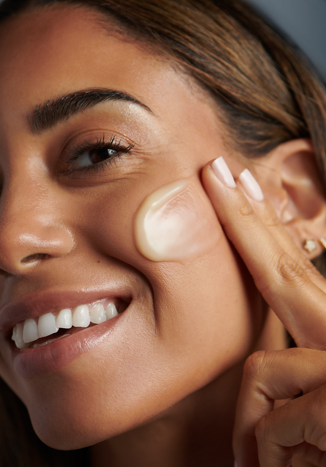 Dermalogica Skincare woman applying skincare